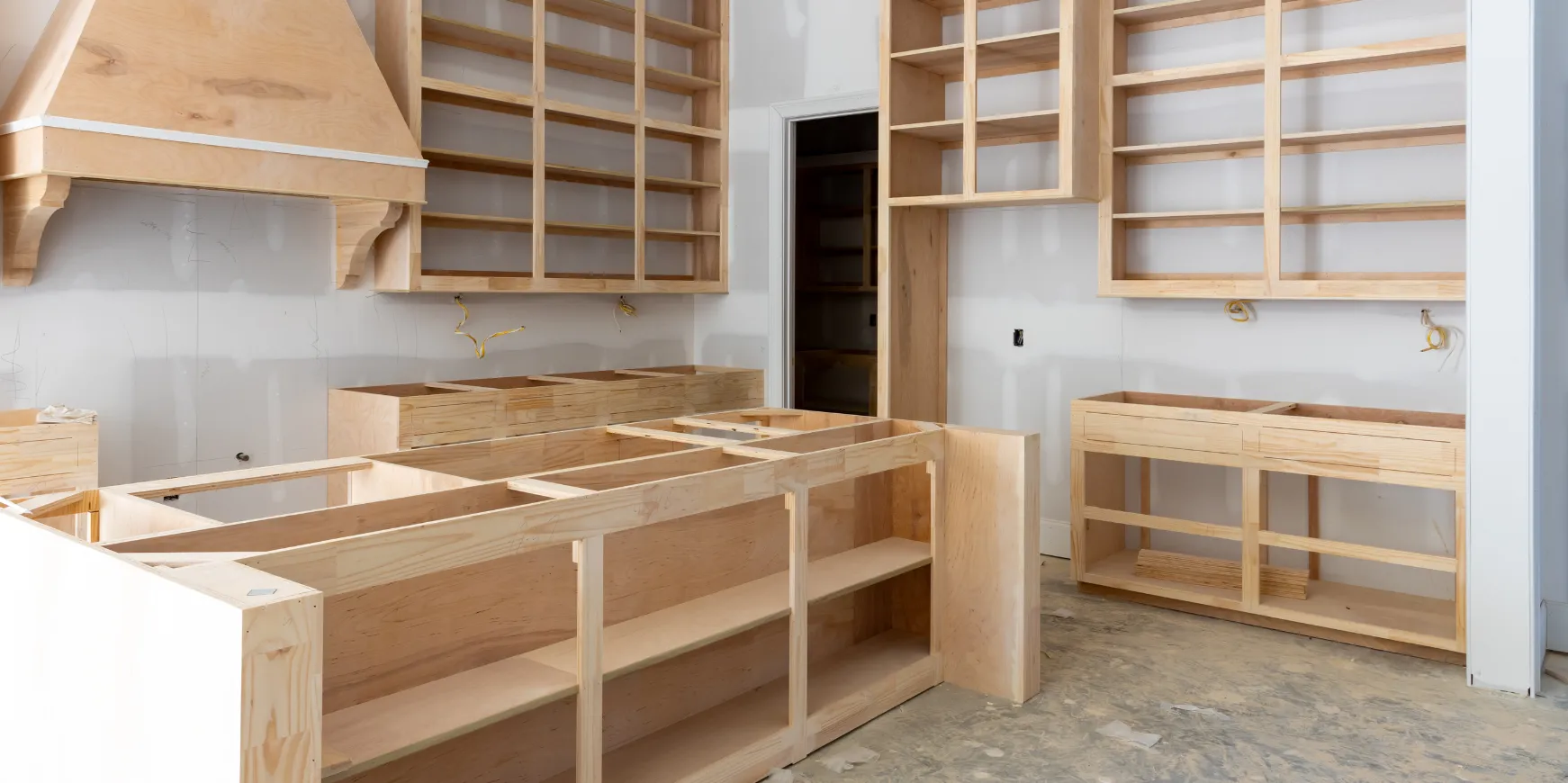 Kitchen remodeling project in Los Angeles during construction with unfinished cabinets and framing
