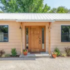 ADU builders in Los Angeles constructing a modern backyard accessory dwelling unit with stucco exterior